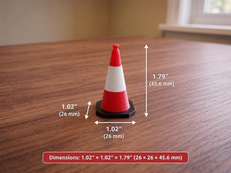 Miniature UK Traffic Cones & Roadwork Barriers Set May include: A miniature traffic cone featuring a red and white striped pattern on a black hexagonal base. The cone measures 26 mm in width and depth, with a total height of 45.6 mm as indicated by the visible dimension labels.