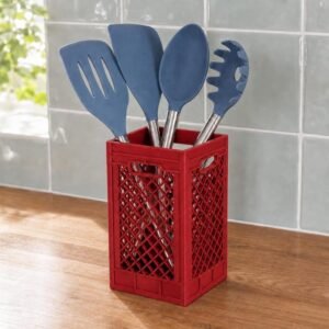 May include: A red rectangular plastic crate utensil holder with a diamond lattice pattern containing four blue silicone kitchen tools with silver metal handles, including a slotted turner, a solid spatula, a spoon, and a pasta server.