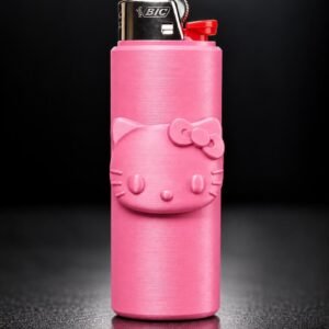 May include: A bright pink BIC lighter featuring a raised, embossed Hello Kitty character face on the front. The lighter has a metallic silver top with the BIC logo and a red ignition button, showcasing a textured finish on the pink casing.