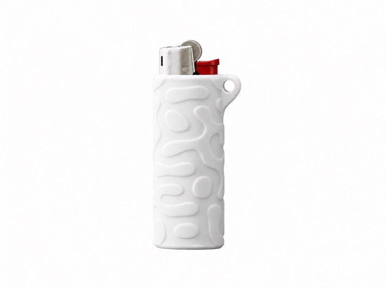 BIC Lighter Keychain Sleeve May include: A white lighter featuring a raised, organic, amoeba-like pattern across its cylindrical body. The top mechanism is metallic silver with a small red ignition button and a circular loop integrated into the upper side of the casing.